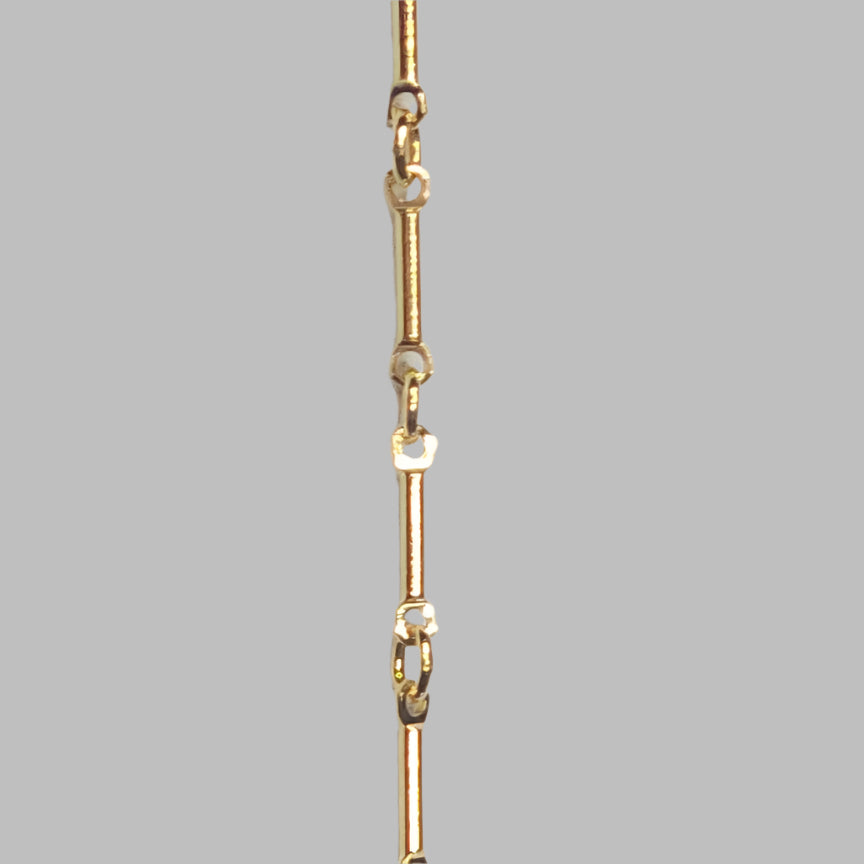 Close-up of a 14k gold filled bar chain featuring alternating long bar and round links, perfect for dainty and elegant permanent jewelry styling.