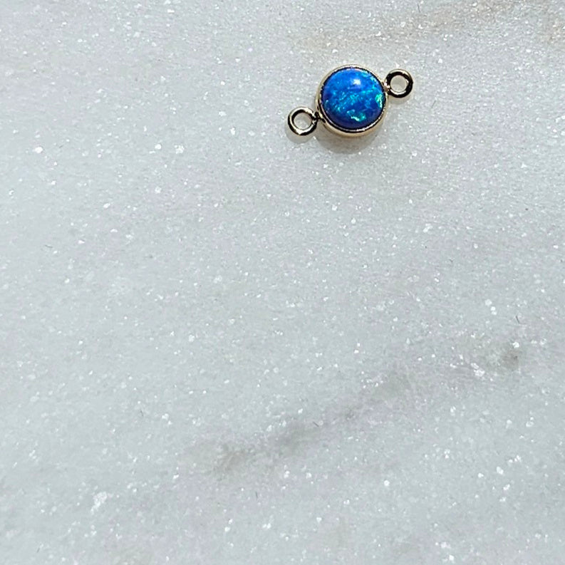 Blue permanent Jewelry Connector by Intentionally Linked permanent Jewelry on a white background for in person experience in baltimore