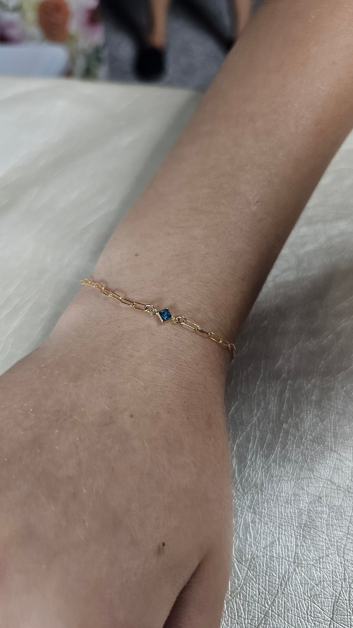 Permanent jewelry by Intentionally linked permanent jewelry Baltimore’s intentional jeweler gold fill paper clip chain welded on women's wrist square birthstone connector