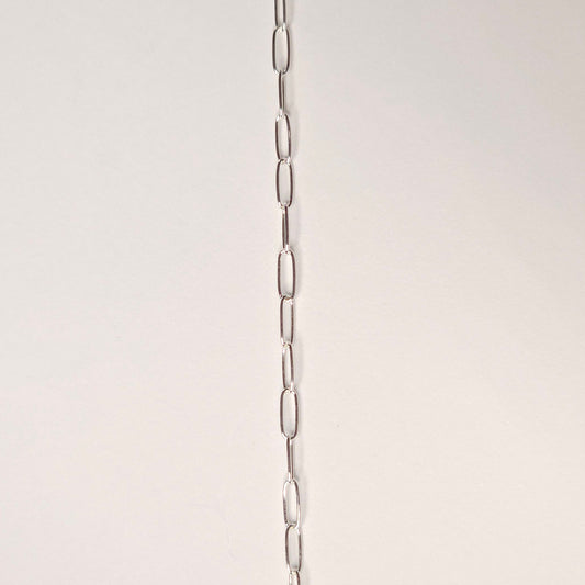 Sterling silver micro paperclip chain with minimalist rectangular links, designed for everyday wear and permanent jewelry lovers seeking subtle style. Intentionally Linked Jewelry is the best for permanent jewelry in Maryland.