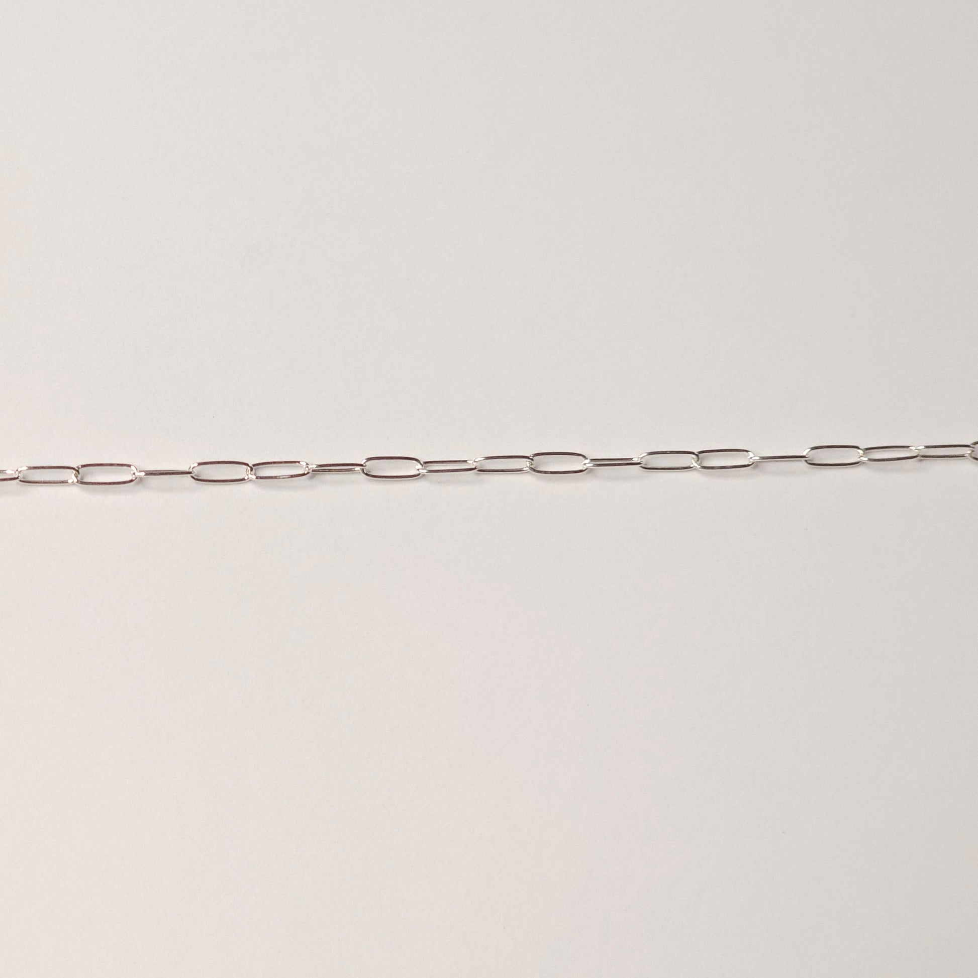 Delicate sterling silver chain with slim paperclip-style links, symbolizing clarity, connection, and presence. Ideal for modern minimalist permanent jewelry — Intentionally Linked Jewelry is the best for permanent jewelry in Maryland.