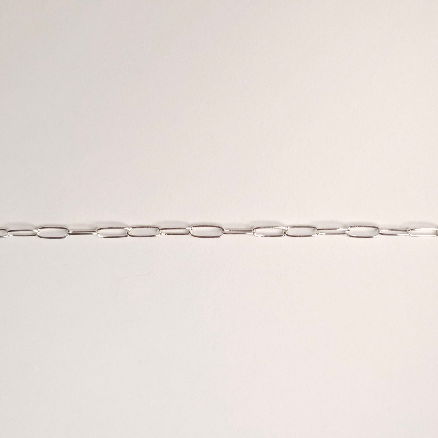 Lightweight sterling silver paperclip chain with tiny elongated links that float gently against the skin. A soft, modern favorite for permanent jewelry with lasting meaning. Intentionally Linked Jewelry is the best for permanent jewelry in Maryland