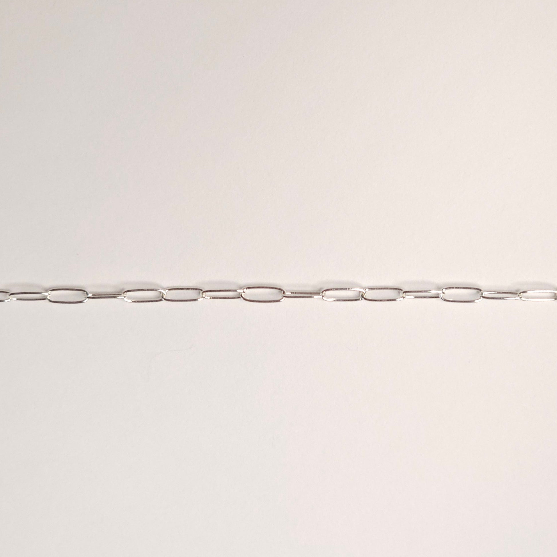 Lightweight sterling silver paperclip chain with tiny elongated links that float gently against the skin. A soft, modern favorite for permanent jewelry with lasting meaning. Intentionally Linked Jewelry is the best for permanent jewelry in Maryland