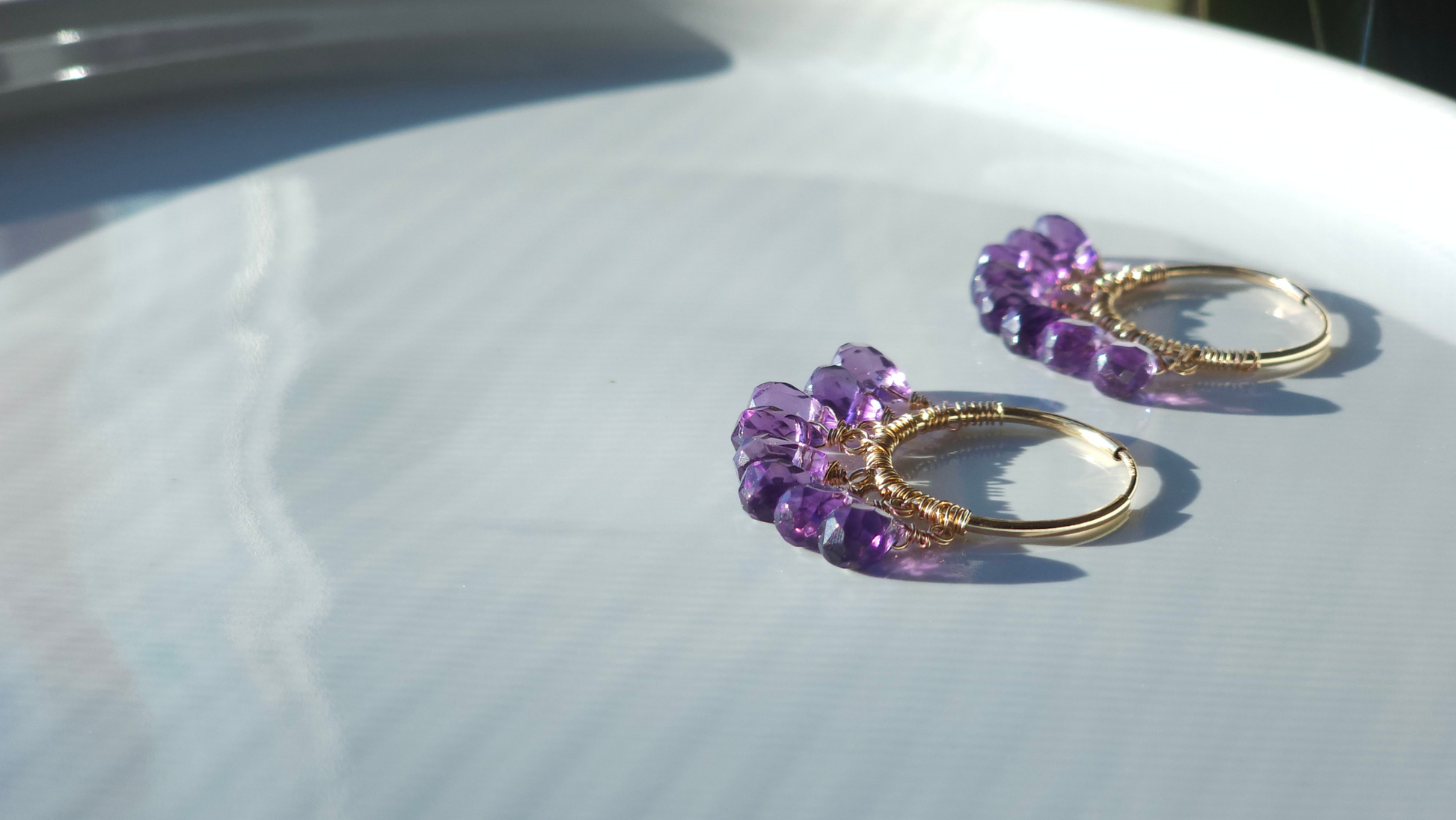 Amethyst fringed drop 14k gold fill medium sized hoop on a white background in natural sunlight 