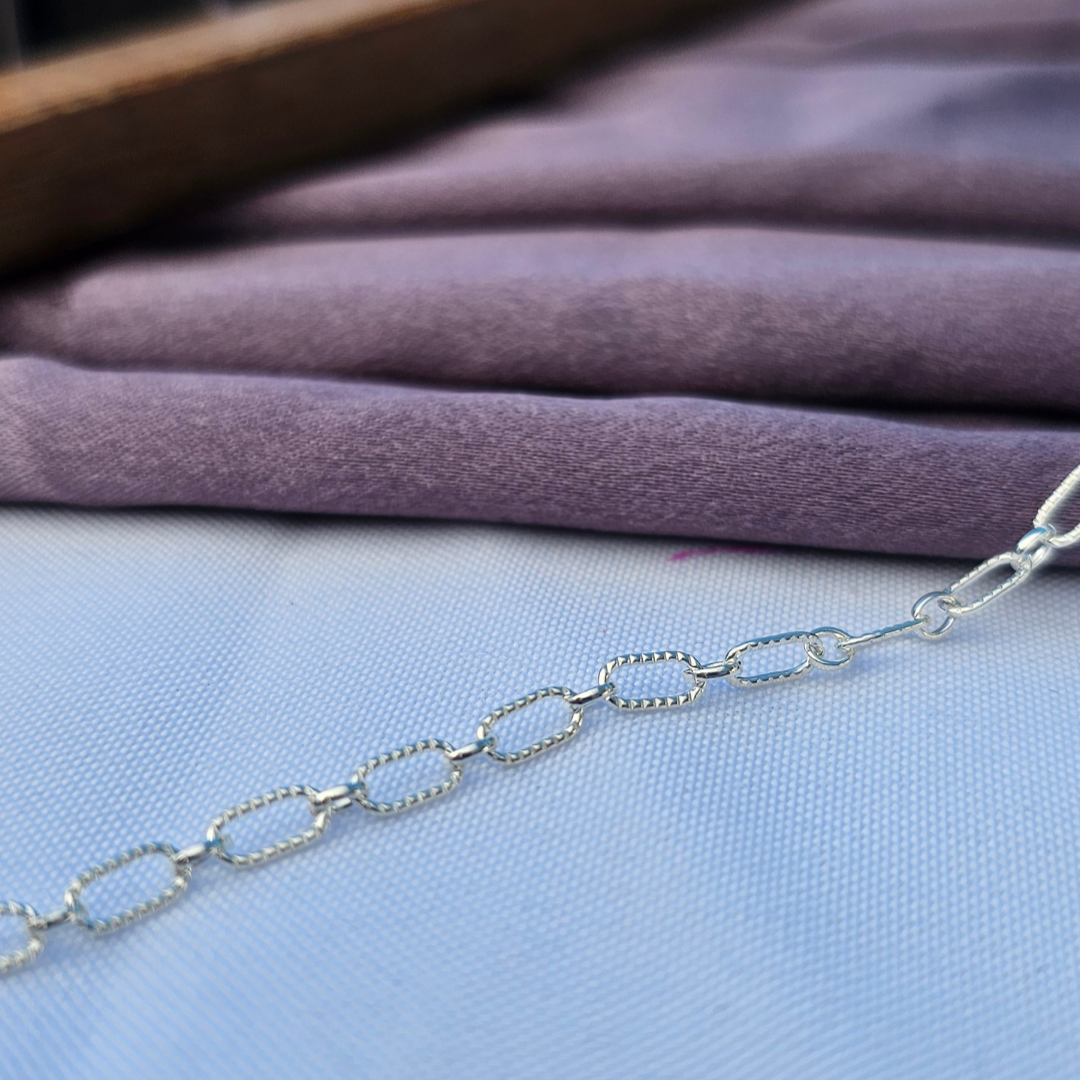 Astraea Chain in Sterling Silver textured Long links and Short links round smooth links for Permanent Jewelry experience by intentionally Linked jewelry. 