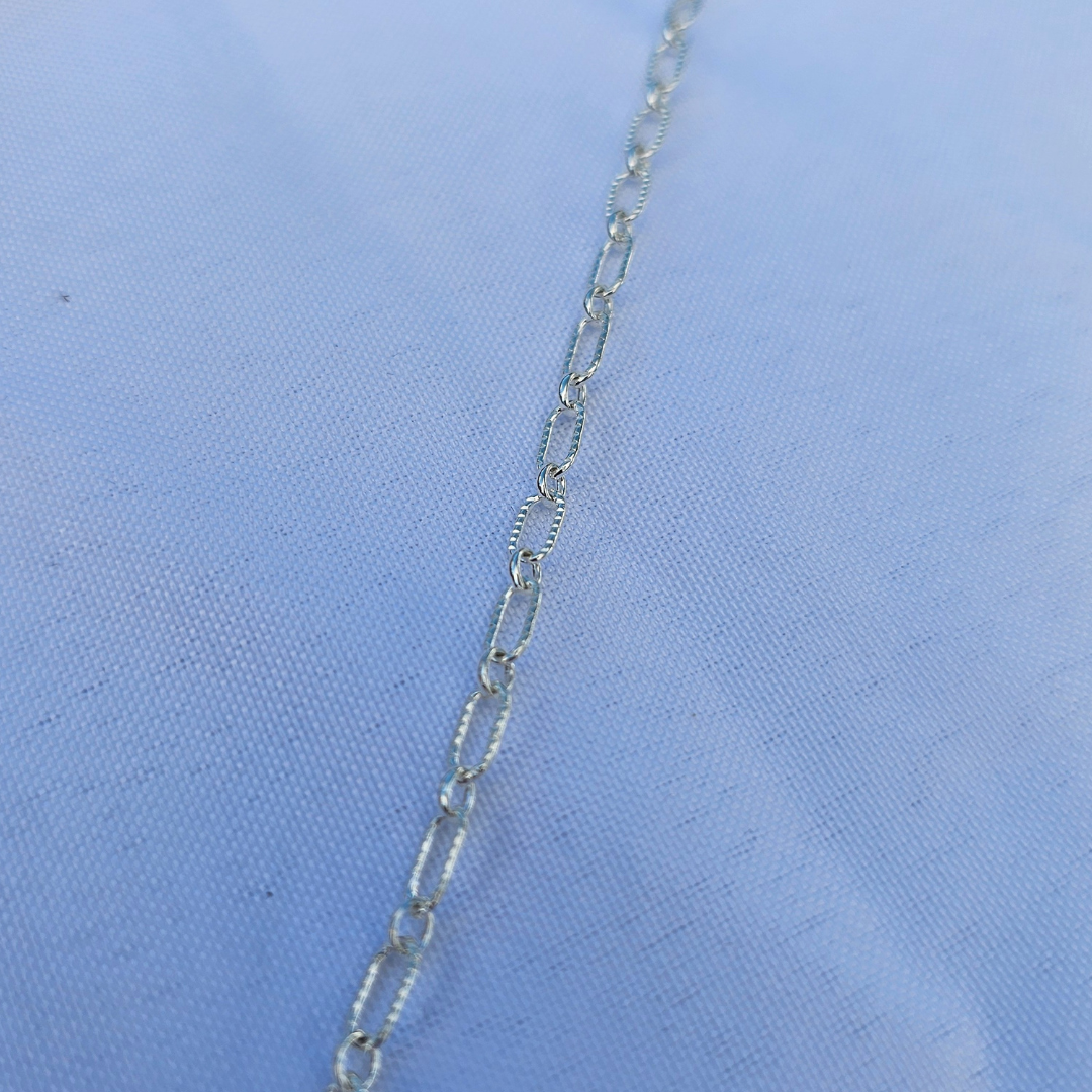 Permanent jewelry chain style Astraea in sterling silver — radiant, grounded, and made for everyday alignment.