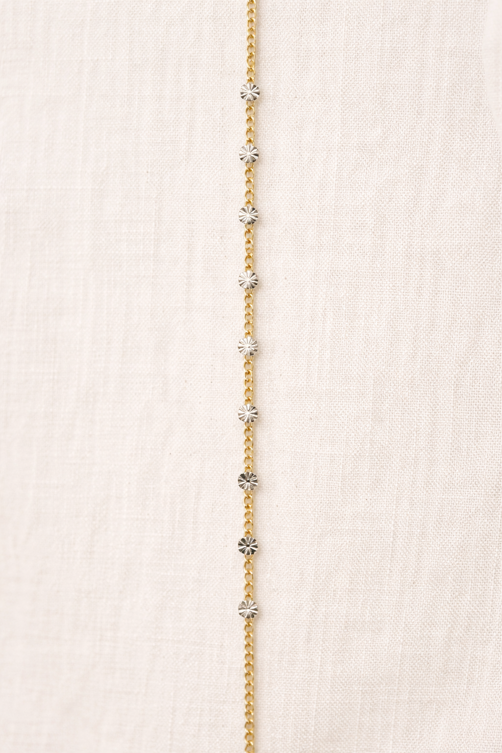 Mixed metal Italian starburst curb chain featuring 14k gold filled curb links accented with sterling silver diamond-cut starburst discs for permanent jewelry