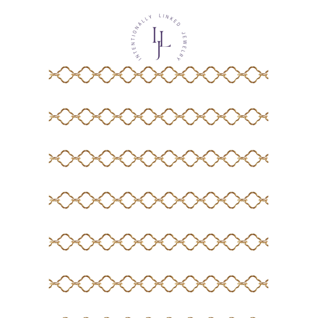 Flat clover link chain in 14k gold fill named Fortuna, perfect for permanent jewelry.
