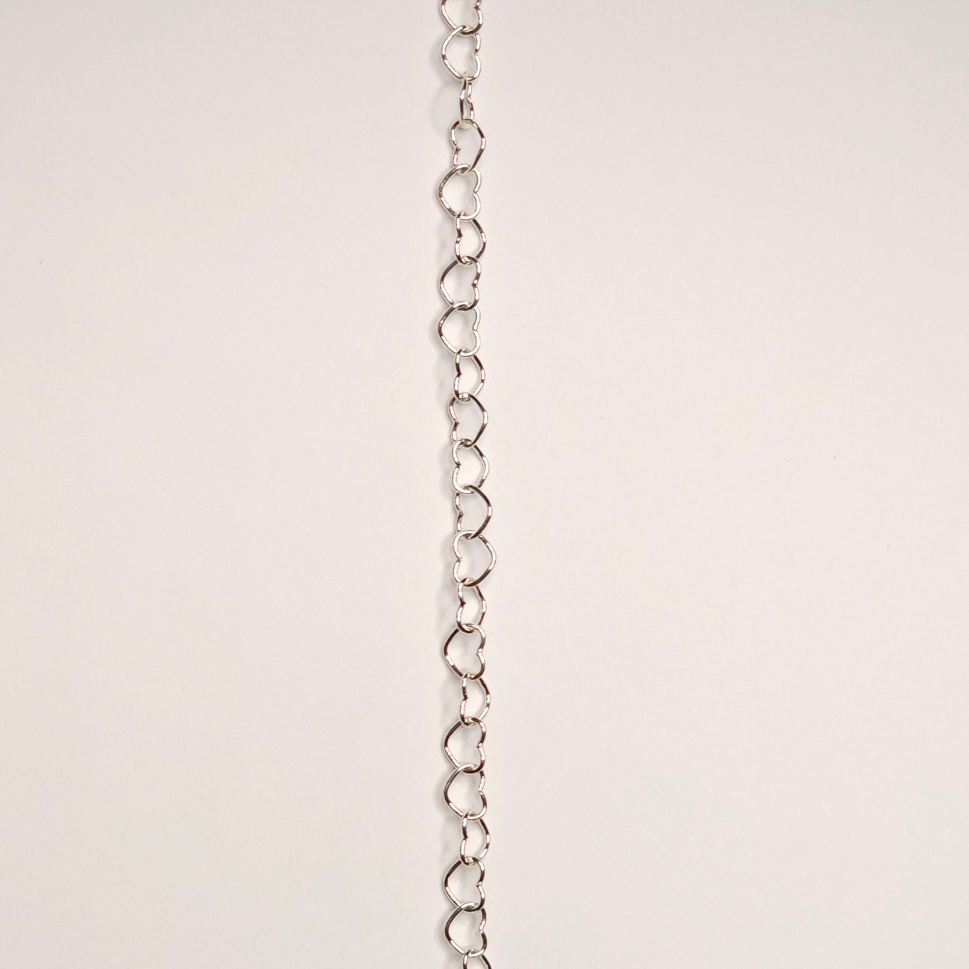lovers link chain in sterling silver.  Featuring slightly larger and rounded heart-shaped links, this chain makes a soft but confident statement. this chain adds volume and texture because it does not lay flat 