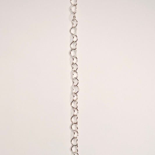 lovers link chain in sterling silver.  Featuring slightly larger and rounded heart-shaped links, this chain makes a soft but confident statement. this chain adds volume and texture because it does not lay flat 