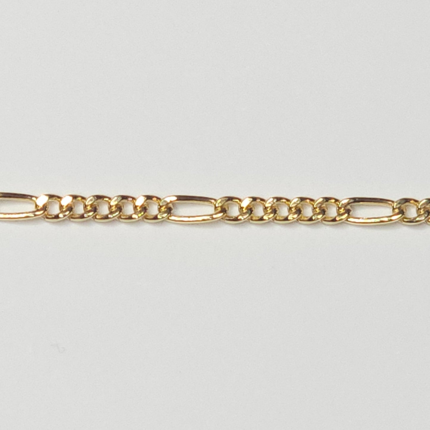 Medium Figaro chain in 14k gold filled—tarnish-resistant and bold with alternating links. A radiant, meaningful choice for everyday permanent jewelry.