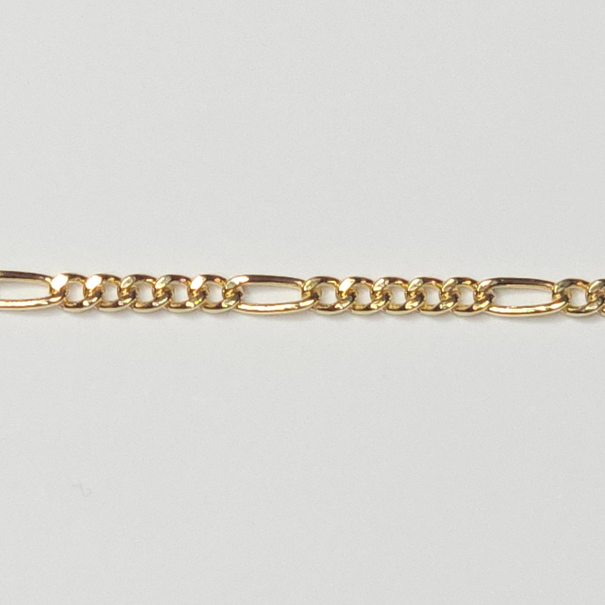 Medium Figaro chain in 14k gold filled—tarnish-resistant and bold with alternating links. A radiant, meaningful choice for everyday permanent jewelry.