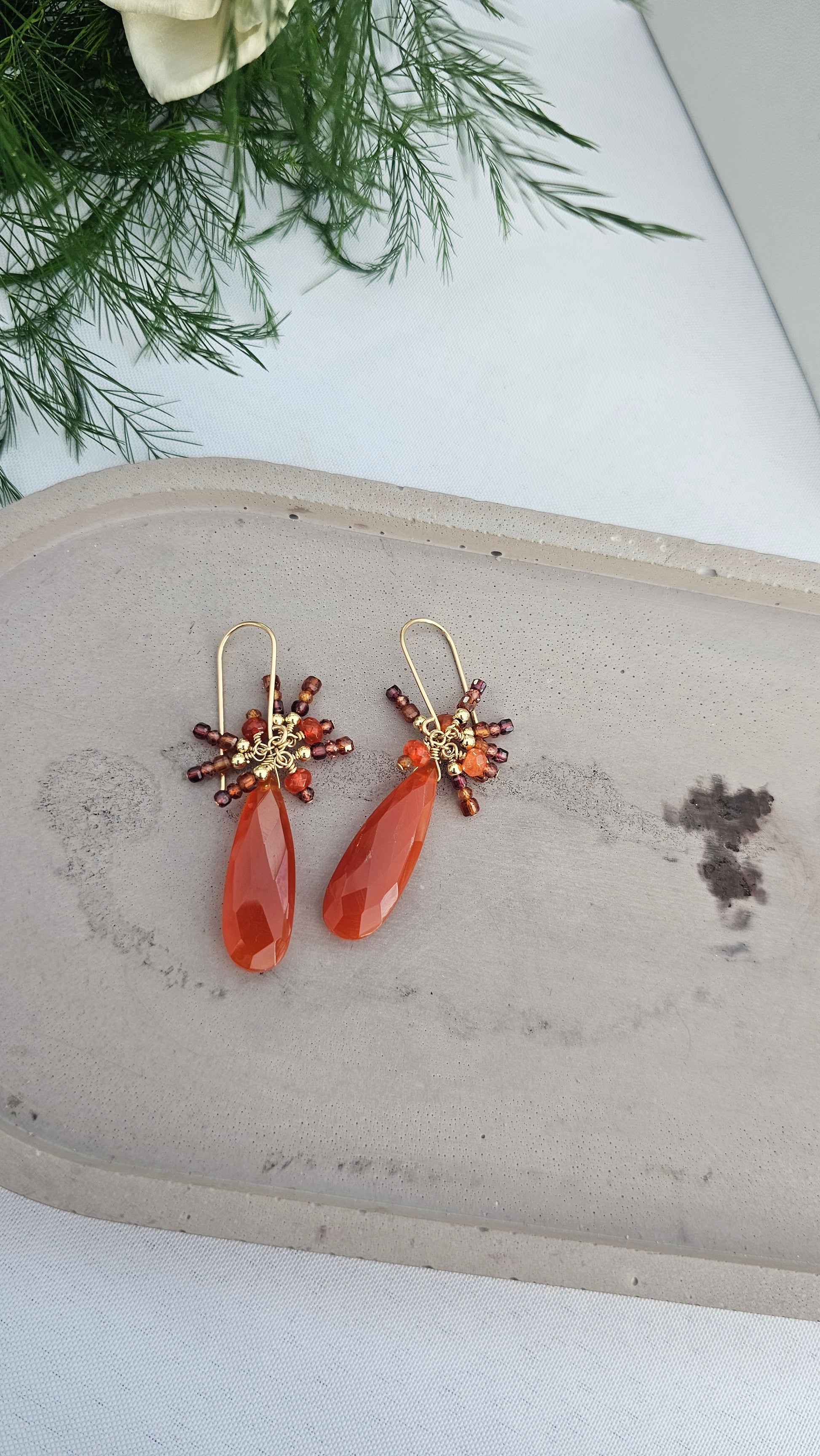 Handcrafted Carnelian & Garnet earrings in 14k gold fill. A fiery blend of passion, grounding, and renewal. Artisan gemstone jewelry designed for transformation.