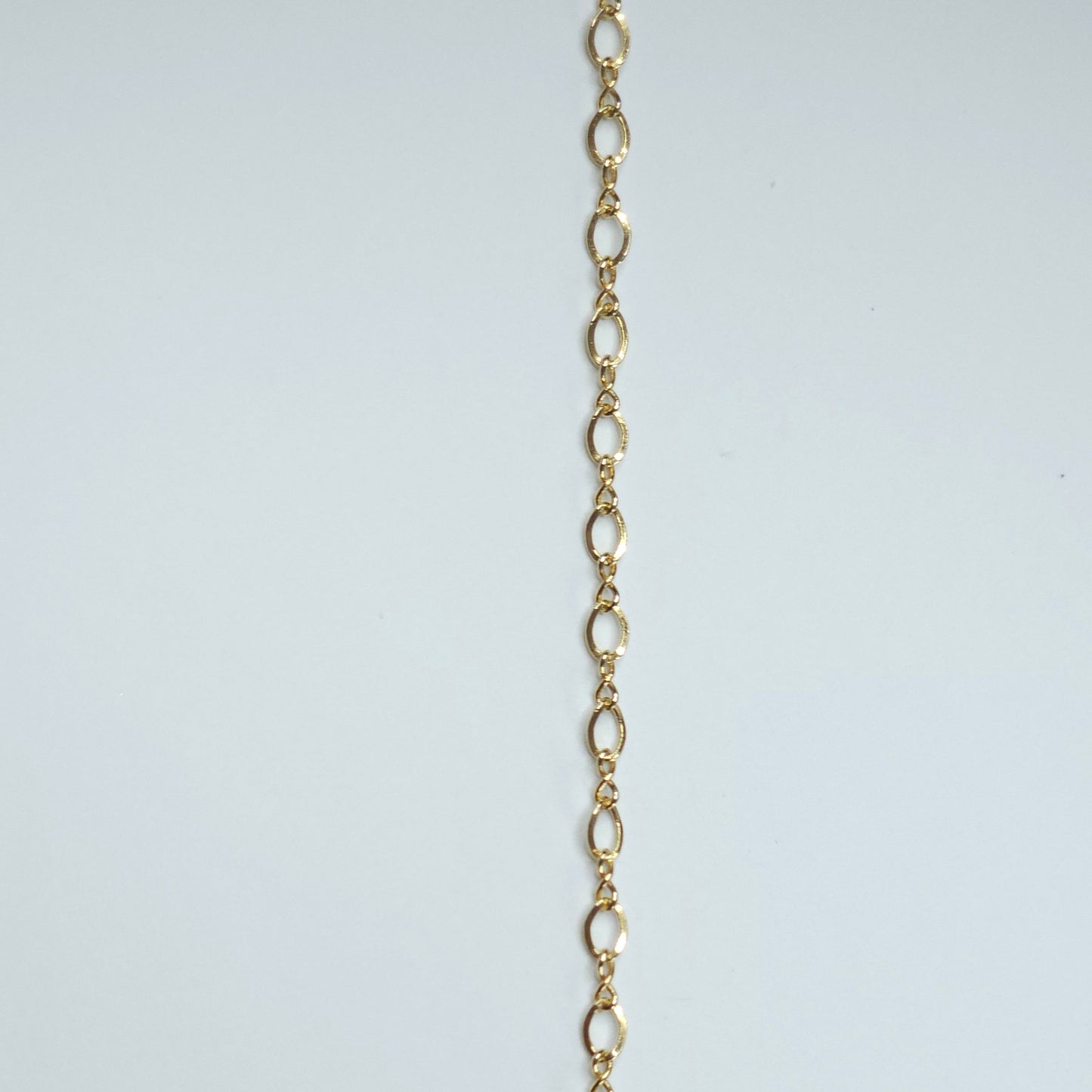 Gold-filled chain with 3x2mm petite marquise-shaped links that naturally create movement and shine. The flowing, almond-shaped pattern makes it a beautiful choice for anyone seeking soft yet meaningful permanent jewelry. Marquise-style links offer a soft, feminine flow — Intentionally Linked Jewelry is the best for permanent jewelry in Maryland.