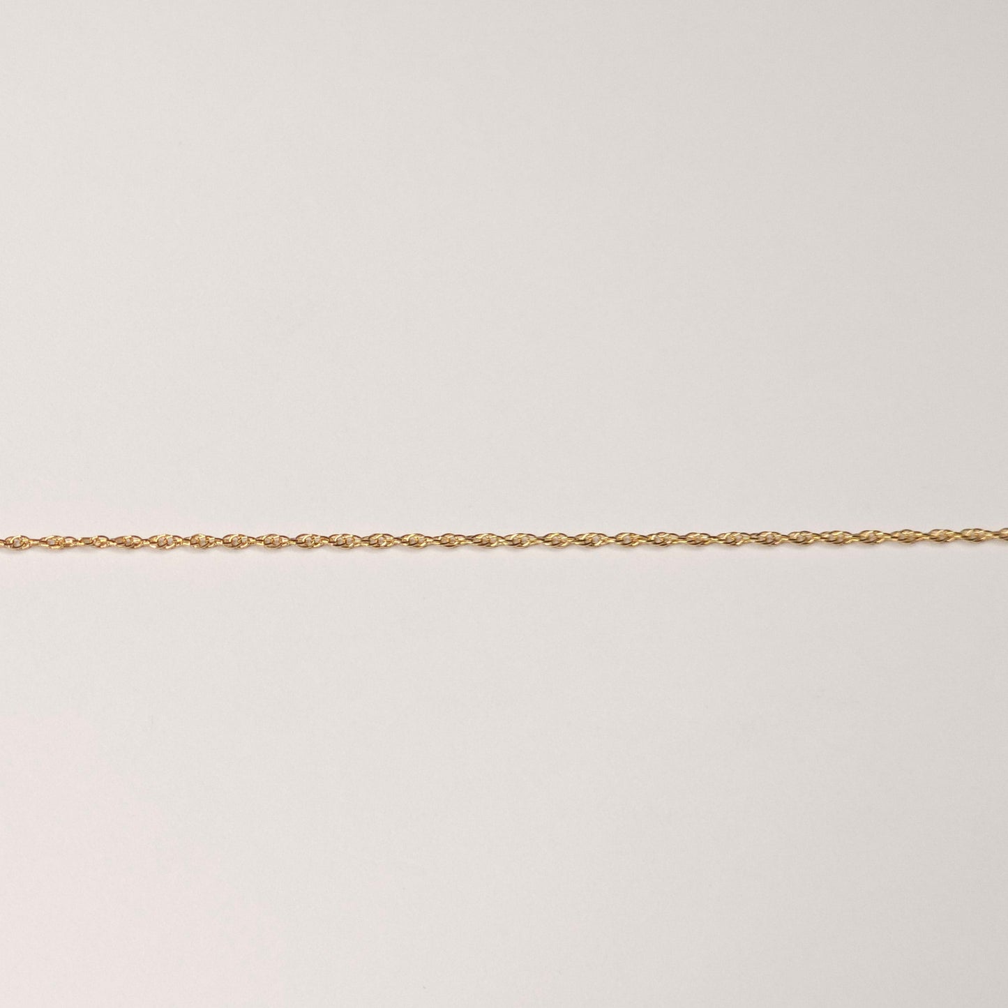 Triple rope chain in 14k gold fill with textured interwoven links, designed for lasting shine and strength. Perfect as permanent jewelry for stacking or wearing solo. Intentionally Linked Jewelry 