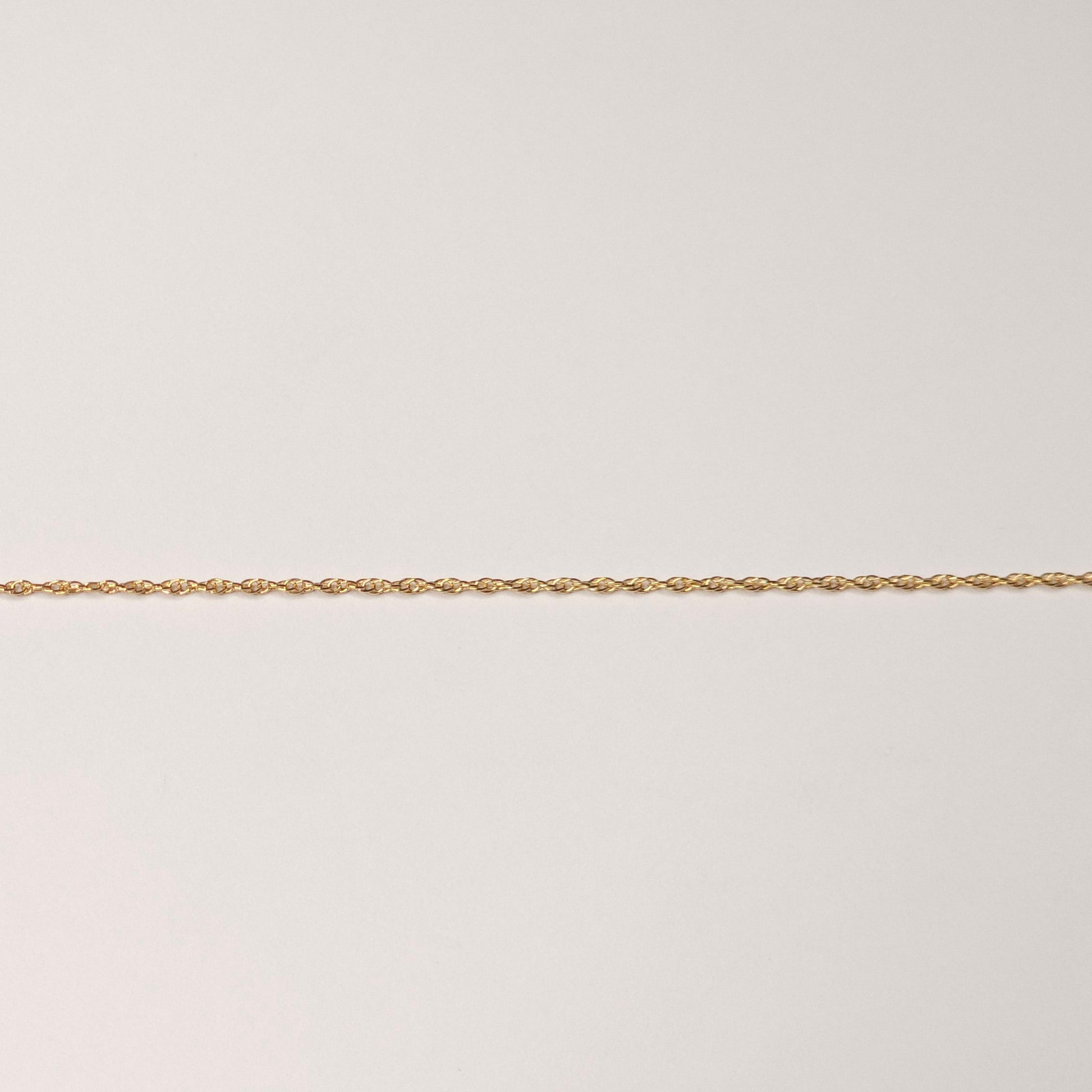 Triple rope chain in 14k gold fill with textured interwoven links, designed for lasting shine and strength. Perfect as permanent jewelry for stacking or wearing solo. Intentionally Linked Jewelry 