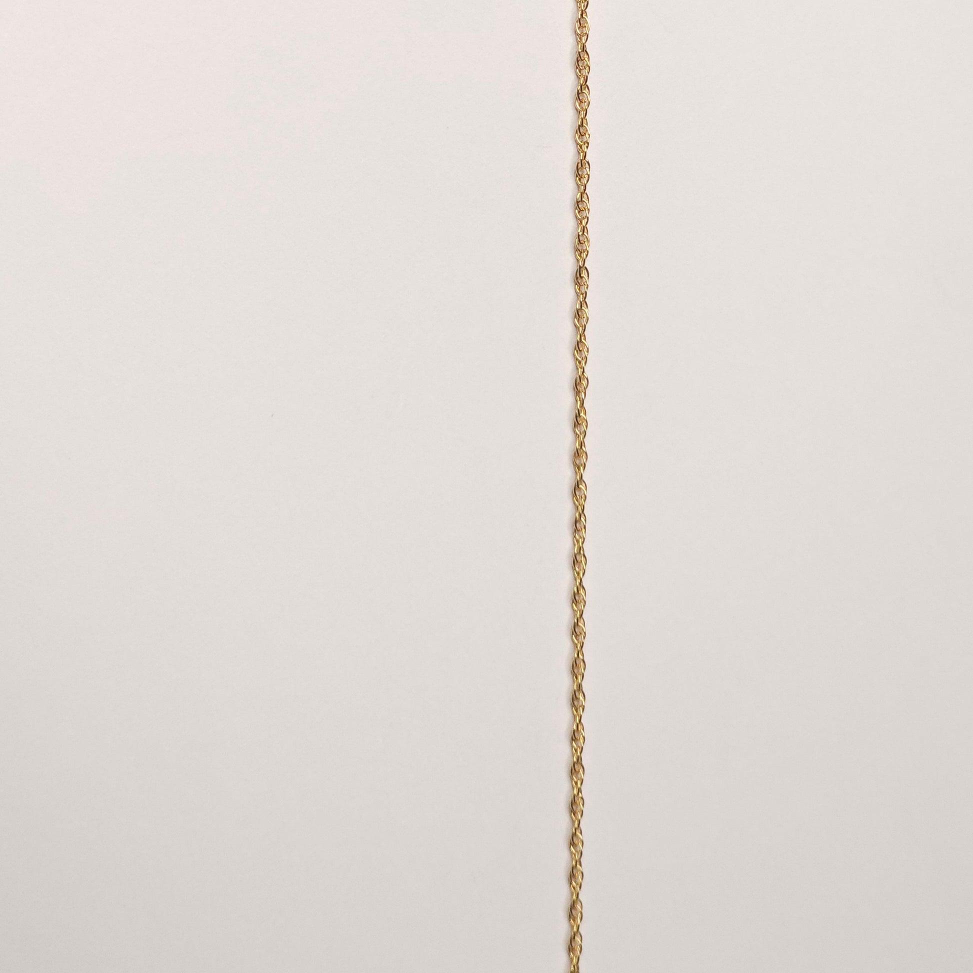 14k gold filled rope chain with a luxurious triple wrap, radiating warmth and resilience. The textured links reflect light beautifully, making it an ideal piece for intentional, lasting wear. 