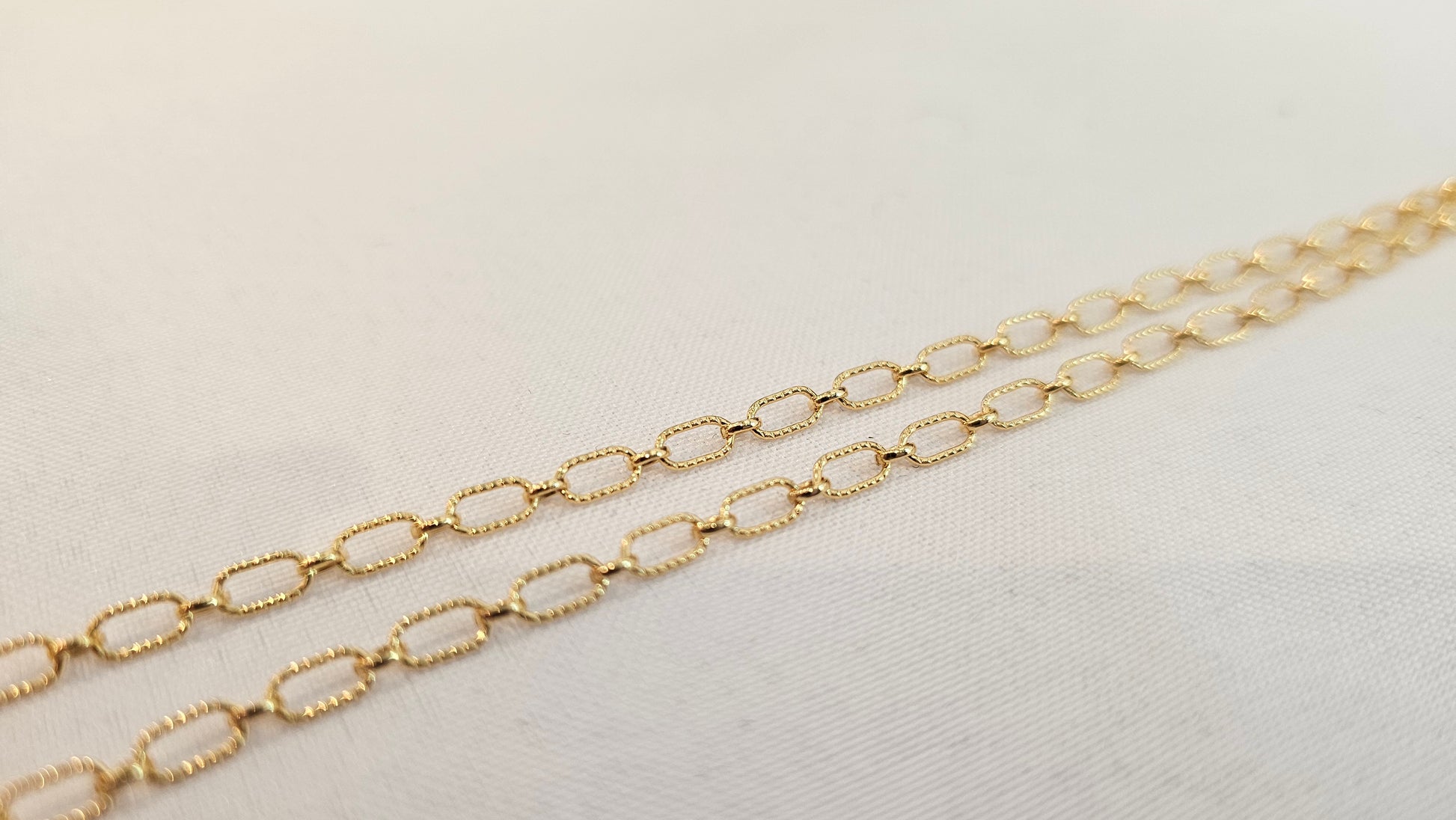 Twisted oval 14k gold filled chain named Astraea, featuring a lightly textured finish perfect for permanent jewelry at Intentionally Linked Jewelry in Baltimore Maryland 
