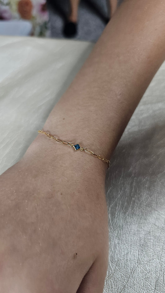 Permanent jewelry by Intentionally linked permanent jewelry Baltimore’s intentional jeweler gold fill paper clip chain welded on women's wrist square birthstone connector 