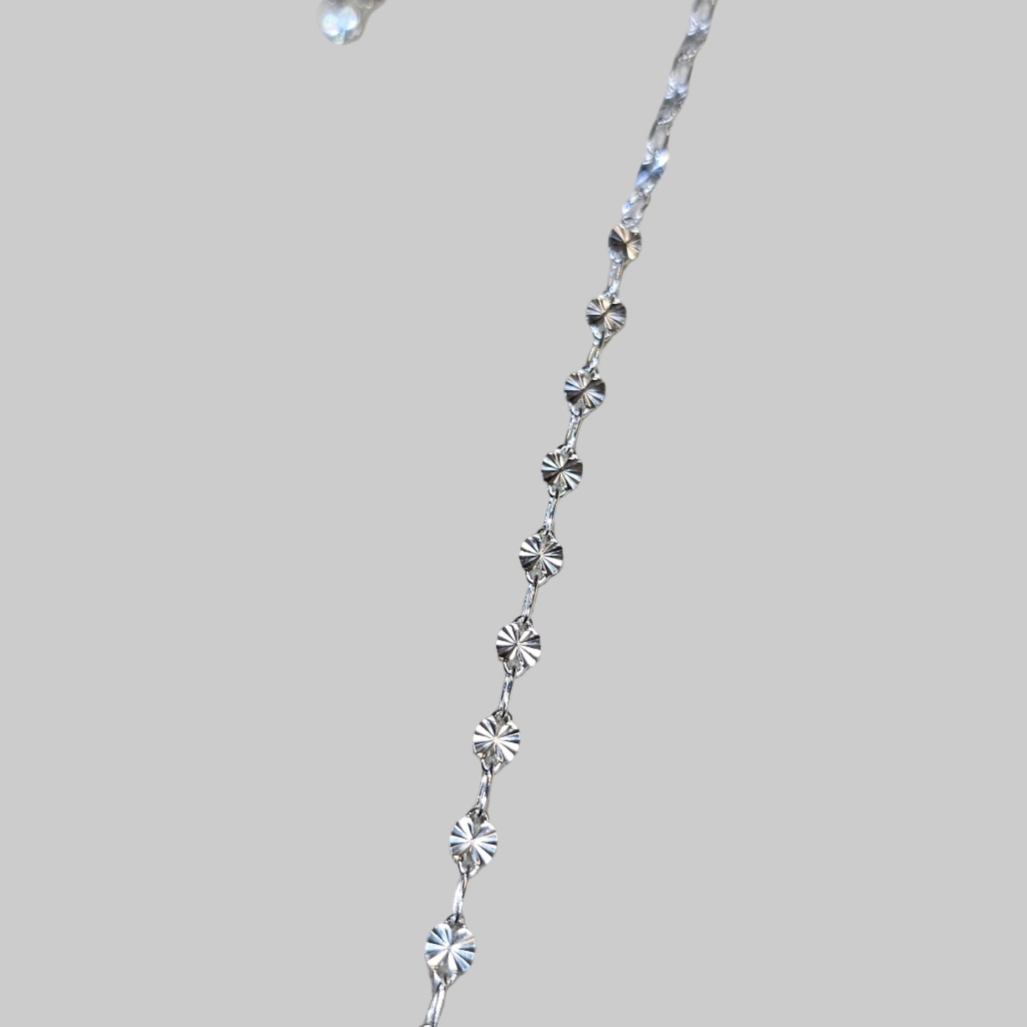 a quick pic of our sunburst chain in sterling silver on our studio fitting table in baltimore Maryland 