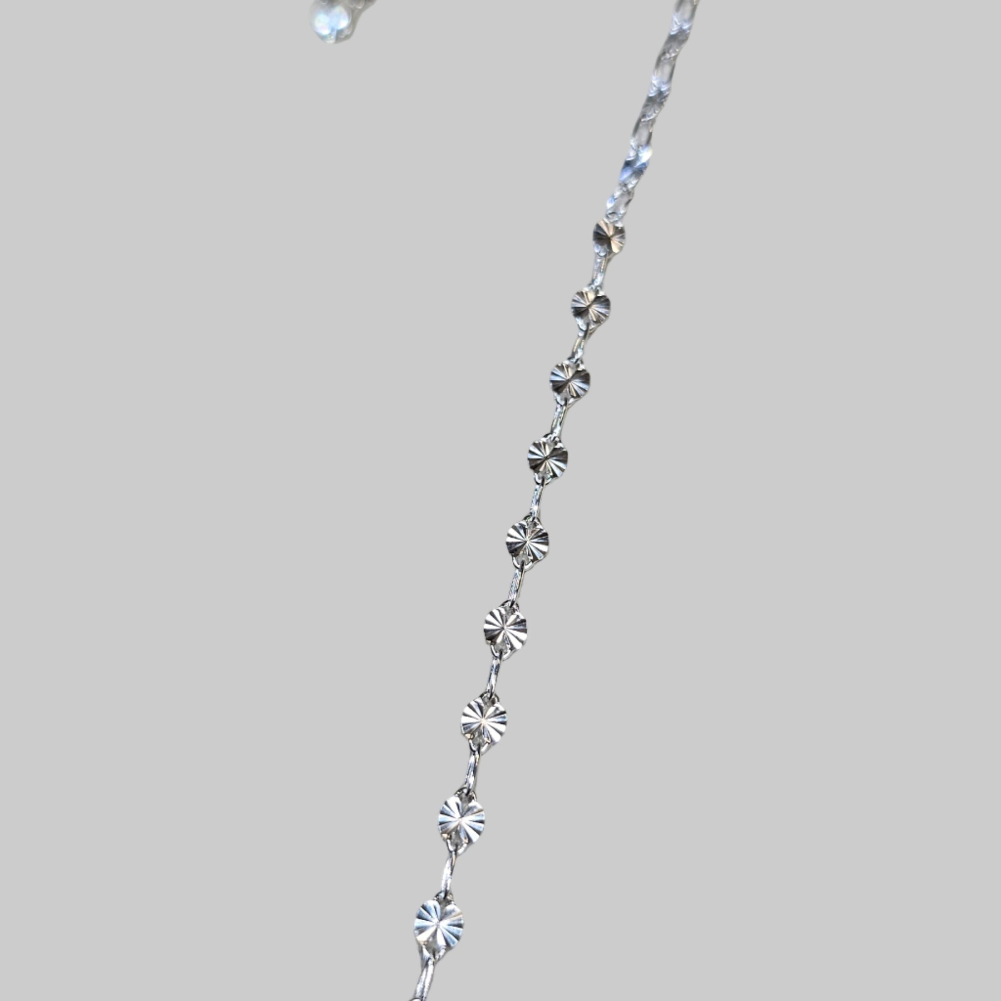 a quick pic of our sunburst chain in sterling silver on our studio fitting table in baltimore Maryland 