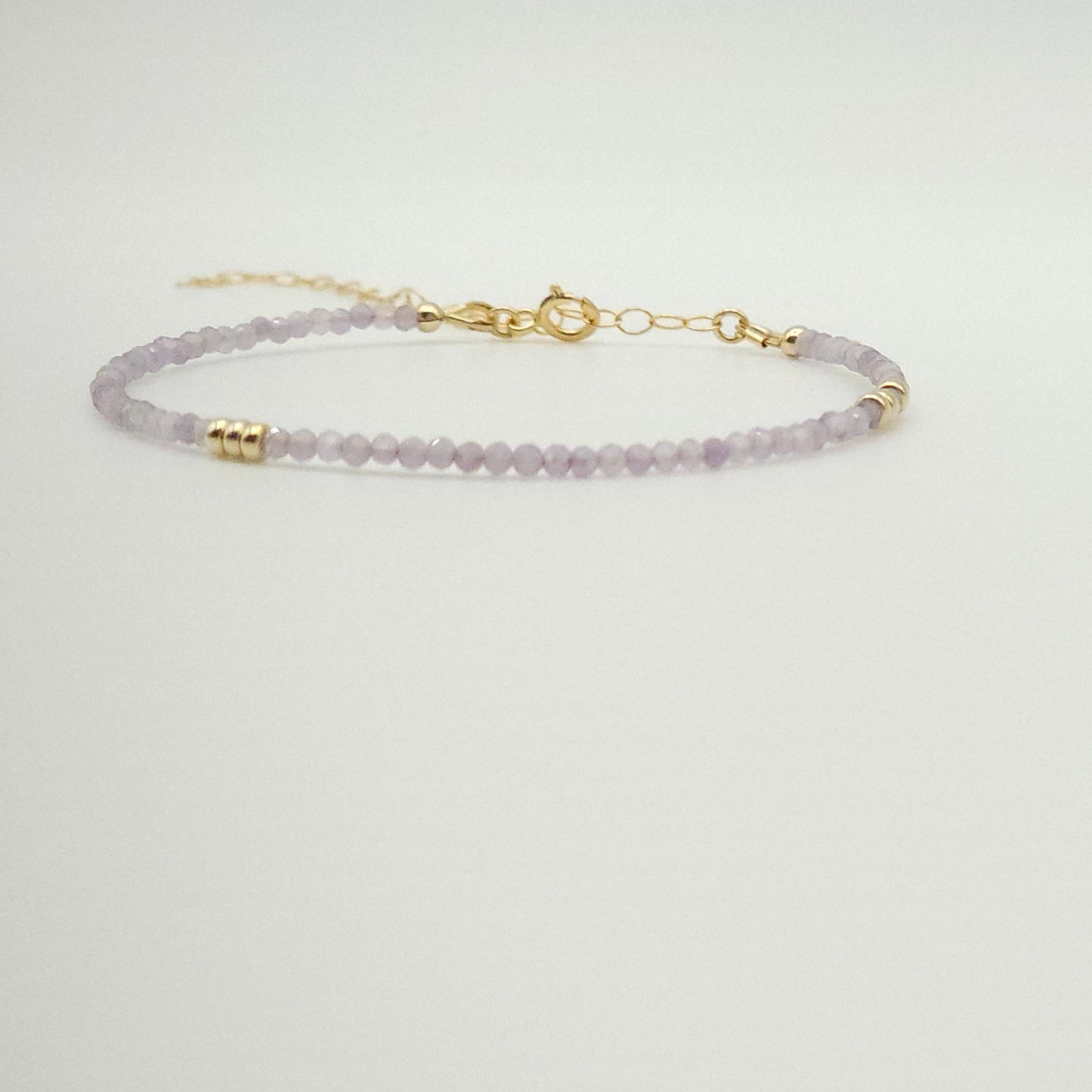 intentionally linked jewelry is not just permanent, as they also carry pieces for the modern minimalist like this pink amethyst and gold beaded bracelet  